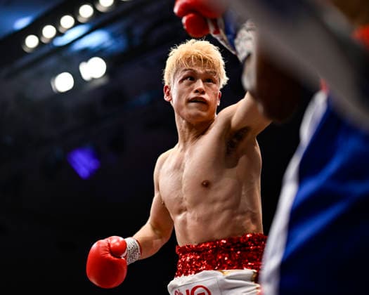 Hayato Tsutsumi (red gloves) of Japan and Felix Batista (blue gloves) of Dominican Republic compete during their WBA Super Featherweight Title Eliminator boxing bout at Korakuen Hall in Tokyo, Japan, July 14, 2026. Noxthirdxpartyxsales  aflo_338074477 HIROAKIxFINITOxYAMAGUCHIx
