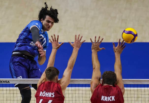 Men s Volleyball Nations League - Belgrade 2026 Slovenia s Nik Mujanovic spikes the ball against Germany s Erik Rohrs and Germany s Tobias Krick during the Men™s Volleyball Nations League Pool 7 match between Germany and Slovenia at Belgrade Arena on July 15, 2026 in Belgrade, Serbia. Belgrade Serbia Copyright: xSrdjanxStevanovicx x