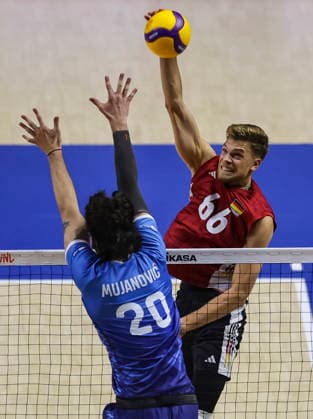Men s Volleyball Nations League - Belgrade 2026 Germany s Erik Rohrs spikes the ball against Slovenia s Nik Mujanovic during the MenÕs Volleyball Nations League Pool 7 match between Germany and Slovenia at Belgrade Arena on July 15, 2026 in Belgrade, Serbia. Belgrade Serbia Copyright: xSrdjanxStevanovicx x