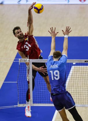 Men s Volleyball Nations League - Belgrade 2026 Germany s Yann Bohme spikes the ball against Slovenia s Rok Mozic during the MenÕs Volleyball Nations League Pool 7 match between Germany and Slovenia at Belgrade Arena on July 15, 2026 in Belgrade, Serbia. Belgrade Serbia Copyright: xSrdjanxStevanovicx x