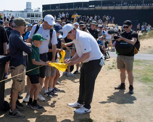 SOUTHPORT, ENGLAND - JULY 15: Robert Macintyre (SCO) signs an autograph for a fan during practice at the 154th Open Championship at the Royal Birkdale Golf Club, Southport on July 15, 2026 in Merseyside, England The 154th British Open Championship