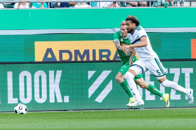 SOCCER - Rapid vs Panathinaikos, test match VIENNA,AUSTRIA,15.JUL.26 - SOCCER - ADMIRAL Bundesliga, Super League, SK Rapid Wien vs Panathinaikos Athen, test match. Image shows Tonni Adamsen (Rapid) and Ahmed Touba (Panathinaikos).  GEPAxpictures xPhilippxBrem