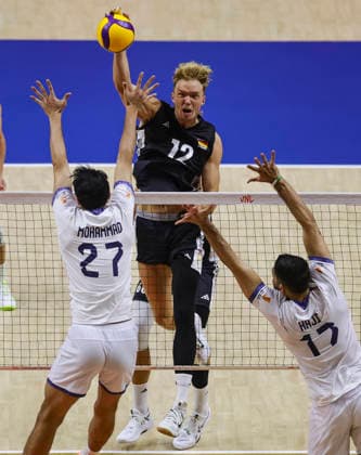 WomenÕs Volleyball Nations League - Belgrade 2026 Germany s Anton Brehme spikes the ball against IranÕs Mohammad Valizadeh and IranÕs Ali Hajipour MoghadDam FaroUji during the MenÕs Volleyball Nations League Pool 7 match between Germany and Iran at Belgrade Arena on July 16, 2026 in Belgrade, Serbia. Belgrade Serbia Copyright: xSrdjanxStevanovicx x