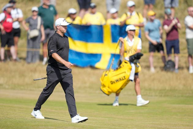SOUTHPORT, ENGLAND - JULY 16: Alex Noren (SWE) walks down the 3rd hole with a Swedish flag in the background during Round 1 of the 154th Open Championship at the Royal Birkdale Golf Club, Southport on July 16, 2026 in Merseyside, England The 154th British Open Championship
