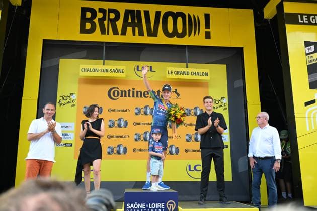 Belgian Tim Merlier of Soudal Quick-Step and Merlier s son Jules celebrate on the podium after winning the stage 12 of the 2026 Tour de France cycling race, a stage of 181km from Nevers Magny-Cours to Chalon-sur-Saone, on Thursday 16 July 2026. The 113th edition of the Tour de France starts on Saturday 4 July in Barcelona, Spain, and will finish in Paris, France on the 26th of July. DAVIDxPINTENS  x181272265x