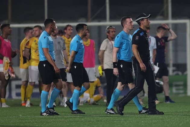 UEFA appointed match referee Jeremy Muller (2nd right) and his assistant referees are escorted by a Malta Police Force official after the UEFA Conference League First Qualifying Round, 2nd Leg match between Hamrun Spartans and Runavik at Centenary Stadium, Ta Qali, Malta on 16 July, 2026. Hamrun Spartans v Runavik - UEFA Conference League First Qualifying Round 1st Leg