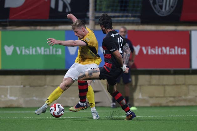 Marius Kryger Lindh (left) of Runavik is in action against Vincenzo Polito of Hamrun Spartans during the UEFA Conference League First Qualifying Round, 2nd Leg match between Hamrun Spartans and Runavik at Centenary Stadium, Ta Qali, Malta on 16 July, 2026. Hamrun Spartans v Runavik - UEFA Conference League First Qualifying Round 1st Leg
