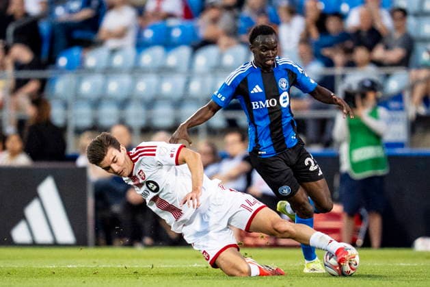 July 16, 2026, Montreal, Pq, Canada: Toronto FC s Alonso Coello (14) tackles CF Montreal s Victor Loturi (22) during first half MLS, Fussball Herren, USA soccer action, in Montreal on Thursday, July 16, 2026. Canada News - July 16, 2026  - ZUMAc35_ 20260716_zaf_c35_126 Copyright: xChristopherxKatsarovx