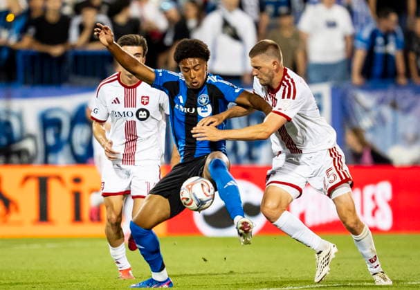 July 16, 2026, Montreal, Pq, Canada: CF Montreal s Owen Graham-Roache (centre) is pressured by Toronto FC s Walker Zimmerman (right) and Alonso Coello (14) during second half MLS, Fussball Herren, USA soccer action, in Montreal on Thursday, July 16, 2026. Canada News - July 16, 2026  - ZUMAc35_ 20260716_zaf_c35_152 Copyright: xChristopherxKatsarovx