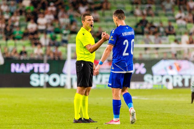 Ferencvaros v Vojvodina, UEFA Europa League qualification, Budapest, Hungary Budapest, Hungary. 16th, July 2026. Referee Vitalijs Spasjonnikovs seen with Dragan Kokanovic (20) of Vojvodina during the UEFA Europa League qualification match between Ferencvaros and Vojvodina at Groupama Arena in Budapest. Hungary, Budapest  Copyright: xGonzalesxPhoto BalazsxPopalx
