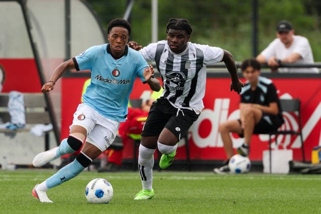 2026-07-17 Feyenoord v Sporting Charleroi - Pre Season Friendly ROTTERDAM, NETHERLANDS - JULY 17: Jivayno Zinhagel of Feyenoord is challenged by Apo Djongambo of Sporting Charleroi during the Pre Season Friendly match between Feyenoord and Sporting Charleroi at Sportcomplex Varkenoord on July 17, 2026 in Rotterdam, Netherlands. Rotterdam Sportcomplex Varkenoord Netherlands Content not available for redistribution in The Netherlands directly or indirectly through any third parties. Copyright: xHansxvanxderxValkx