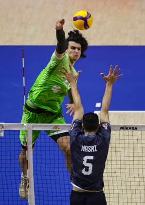 WomenÕs Volleyball Nations League - Belgrade 2026 Slovenia s Nik Mujanovic spikes the ball against IranÕs Mobin Nasri Mastanabad during the MenÕs Volleyball Nations League Pool 7 match between Iran and Slovenia at Belgrade Arena on July 17, 2026 in Belgrade, Serbia. Belgrade Serbia Copyright: xSrdjanxStevanovicx x