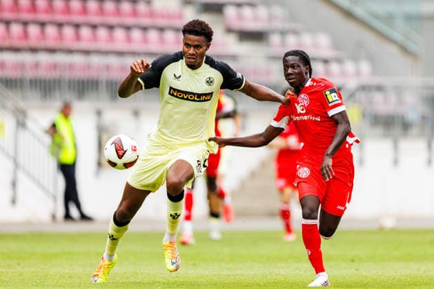 MAINZ, GERMANY - JULY 17: k45 and Jeremiah Debrah (1. FSV Mainz 05, 38) compete for the ball during the exhibition game between 1. FSV Mainz 05 vs. 1. FC Kaiserslautern at Bruchweg Stadium in preparation for the Bundesliga season 2026 27 on July 17, 2026 in Mainz, Germany. DFL REGULATIONS PROHIBIT ANY USE OF PHOTOGRAPHS AS IMAGE SEQUENCES AND OR QUASI-VIDEO. Rhineland-Palatinate Germany Copyright: xStephanxHahnex