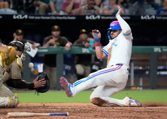 July 17, 2026: San Diego Padres catcher Luis Campusano (12) looses the ball as Kansas City Royals first baseman Vinnie Pasquantino (9) slides to the plate at Kauffman Stadium Kansas City, Missouri. CSM. Kansas City United States - ZUMAc04_ 20260717_zma_c04_181 Copyright: xJonxRobichaudx
