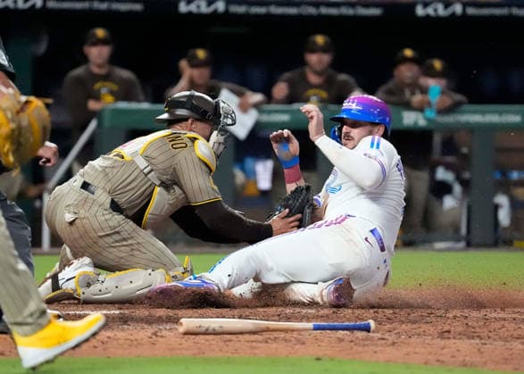 July 17, 2026: Luis Campusano (12) applies the tag but without the ball on Kansas City Royals first baseman Vinnie Pasquantino at Kauffman Stadium Kansas City, Missouri. CSM. Kansas City United States - ZUMAc04_ 20260717_zma_c04_184 Copyright: xJonxRobichaudx