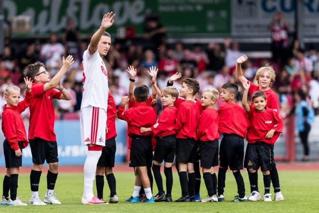 COLOGNE, GERMANY - JULY 18: Said El Mala (1. FC Koeln, 13) walking in with a crowd of mascots before the first friendly game of season 2026 27 between 1. FC Koeln vs FC Rheinsued Koeln at Suedstadion on July 18, 2026 in Cologne, Germany. North Rhine Westphalia Germany Copyright: xSteffiexWunderlx