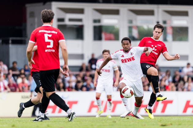 COLOGNE, GERMANY - JULY 18: Youssoupha Niang (1. FC Koeln, 38) controls the ball against Nik Anton Ortner (FC Rheinsued Koeln, 6) during the first friendly game of season 2026 27 between 1. FC Koeln vs FC Rheinsued Koeln at Suedstadion on July 18, 2026 in Cologne, Germany. North Rhine Westphalia Germany Copyright: xSteffiexWunderlx