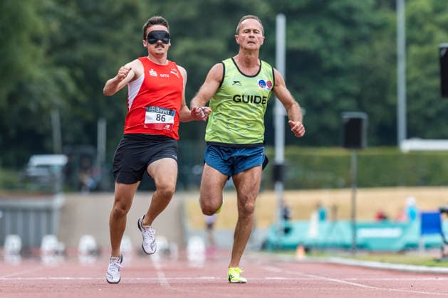 LEVERKUSEN, GERMANY - JULY 18, 2026 : Marcel Boettger (GER LG Olympia Dortmund) and his guide Alexander Kosenkow competing in the 100m during the Para Heimspiel 7.0 at Fritz Jacobi Sports Complex on July 18, 2026 in Leverkusen, Germany. Northrhine-Westphalia Germany Copyright: xAxelxKohringx