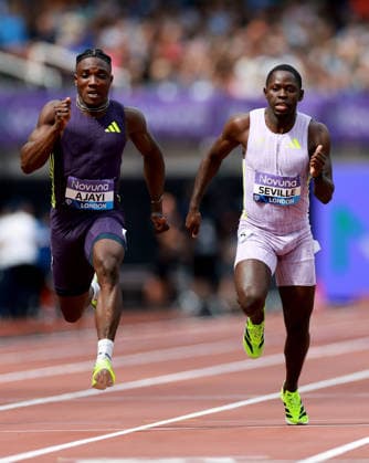 Kayinsola Ajayi of Nigeria and Oblique Seville of Jamaica during the 100m Men. The London Athletics Meet, Wanda Diamond League, London Stadium, London, UK - 18 Jul 2026London London Stadium United Kingdom  Copyright: xJamesxMarsh Shutterstockx 16996766ay