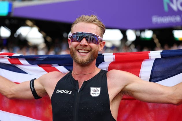 RECORD DATE NOT STATED 18th July 2026; London Stadium, London, England; 2026 Diamond League Novuna London Athletics Meet; Josh Kerr of Great Britain celebrates with the Union Jack flag after achieving the 1 Mile Men World Record in 3:42:66 JohnxPatrickxFletcher