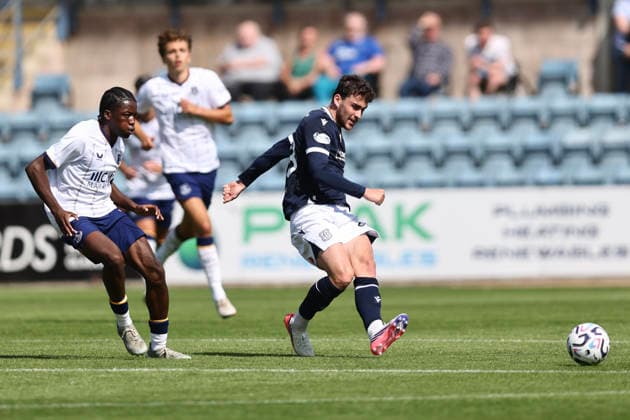 RECORD DATE NOT STATED 18th July 2026; Dens Park, Dundee, Scotland; Friendly Football, Dundee versus Everton; Callum Jones of Dundee hits a pass while Makik Olayiwoa of Everton tries to close him down DavidxYoung