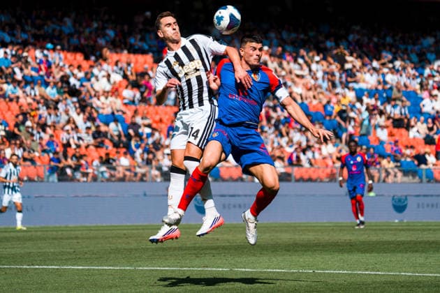 BASEL, SWITZERLAND - JULY 18: battles for the ball with Arkadiusz Milik of Juventus and Flavius Daniliuc of Basel during the pre-season friendly match between FC Basel 1893 and Juventus at St. Jakob Stadium on July 18, 2026 in Basel, Switzerland. *** BASEL, SWITZERLAND, JULY 18 — Arkadiusz Milik of Juventus and Flavius Daniliuc of Basel battle for the ball during the preseason friendly match between FC Basel 1893 and Juventus at St. Jakob Stadium on July 18, 2026, in Basel, Switzerland Copyright: xJustPictures.ch PascalxvonxBürenx jp-en-EuSpIm-Pavo_Fotografie-05542