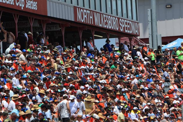 NORTH WILKESBORO, NC - JULY 18: Race fans sit in the sun during the running of the NASCAR, Motorsport, USA Craftsman Truck Series FaithFest 250 on July 18, 2026 at North Wilkesboro Speedway in North Wilkesboro, NC. (Photo by Jeff Robinson Icon Sportswire) AUTO: JUL 18 NASCAR CRAFTSMAN Truck Series Faith Fest 250 EDITORIAL USE ONLY Icon26071824761250