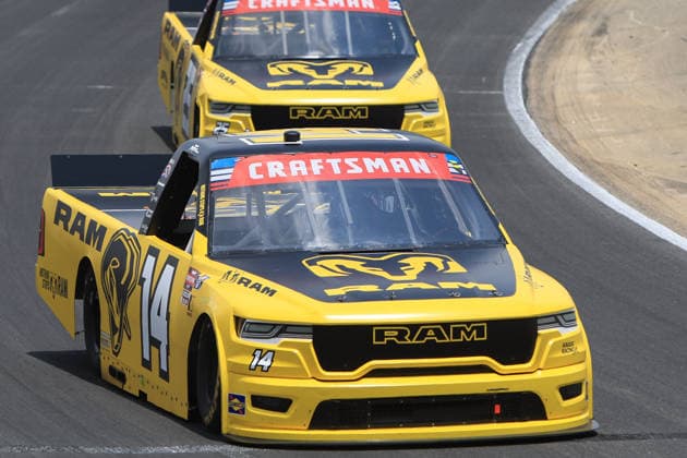 NORTH WILKESBORO, NC - JULY 18: Mini Tyrrell ( 14 Kaulig Racing RAM) races Ryan Newman ( 25 Kaulig Racing RAM) into turn 1 during the running of the NASCAR, Motorsport, USA Craftsman Truck Series FaithFest 250 on July 18, 2026 at North Wilkesboro Speedway in North Wilkesboro, NC. (Photo by Jeff Robinson Icon Sportswire) AUTO: JUL 18 NASCAR CRAFTSMAN Truck Series Faith Fest 250 EDITORIAL USE ONLY Icon26071824963250