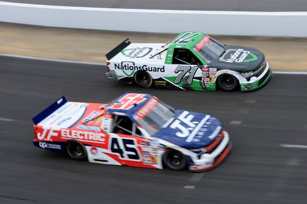 NORTH WILKESBORO, NC - JULY 18: Shane Van Gisbergen ( 71 Spire Motorsports NationsGuard Chevrolet) races with Landen Lewis ( 45 Niece Motorsports J.F. Electric Utilitra Chevrolet) in turn 4 during the running of the NASCAR, Motorsport, USA Craftsman Truck Series FaithFest 250 on July 18, 2026 at North Wilkesboro Speedway in North Wilkesboro, NC. (Photo by Jeff Robinson Icon Sportswire) AUTO: JUL 18 NASCAR CRAFTSMAN Truck Series Faith Fest 250 EDITORIAL USE ONLY Icon26071825222250