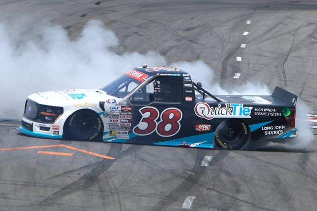 NORTH WILKESBORO, NC - JULY 18: Chandler Smith ( 38 Front Row Motorsports QuickTie Ford) celebrates after winning the NASCAR, Motorsport, USA Craftsman Truck Series FaithFest 250 on July 18, 2026 at North Wilkesboro Speedway in North Wilkesboro, NC. (Photo by Jeff Robinson Icon Sportswire) AUTO: JUL 18 NASCAR CRAFTSMAN Truck Series Faith Fest 250 EDITORIAL USE ONLY Icon26071826010250