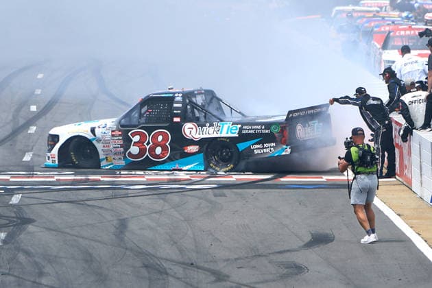 NORTH WILKESBORO, NC - JULY 18: Chandler Smith ( 38 Front Row Motorsports QuickTie Ford) celebrates after winning the NASCAR, Motorsport, USA Craftsman Truck Series FaithFest 250 on July 18, 2026 at North Wilkesboro Speedway in North Wilkesboro, NC. (Photo by Jeff Robinson Icon Sportswire) AUTO: JUL 18 NASCAR CRAFTSMAN Truck Series Faith Fest 250 EDITORIAL USE ONLY Icon26071826095250