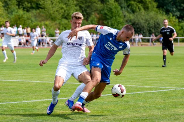 v.li.: Tino Bradara (SGV, 2), Tim Lemperle (Hoffenheim, 19), Zweikampf, Spielszene, Duell, duel, tackle, tackling, Dynamik, Action, Aktion, 18.07.2026, Bad Friedrichshall (Deutschland), Fussball, Testspiel, TSG 1899 Hoffenheim - SGV Heilbronn-Freiberg, DFB DFL REGULATIONS PROHIBIT ANY USE OF PHOTOGRAPHS AS IMAGE SEQUENCES AND OR QUASI-VIDEO. *** From left: Tino Bradara (SGV), 2; Tim Lemperle (Hoffenheim), 19; tackle, game scene, duel, tackle, tackling, dynamism, action, 18 July 2026, Bad Friedrichshall, Germany, soccer, friendly match, TSG 1899 Hoffenheim vs. SGV Heilbronn Freiberg, DFB and DFL regulations prohibit any use of photographs as image sequences and or quasi-video xozx