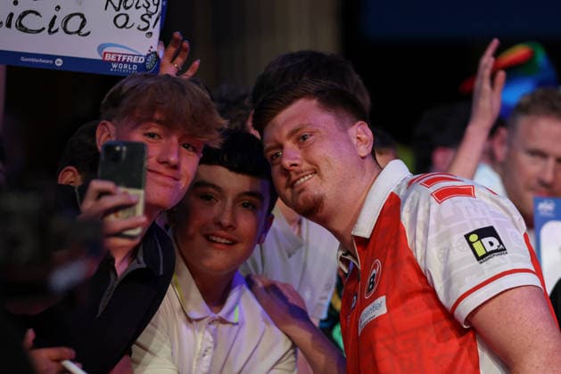 RECORD DATE NOT STATED 18th July 2026, Winter Gardens, Blackpool, Lancashire, England; 2026 Betfred World Matchplay Darts, Day One; Niko Springer takes a selfie win fans during his walk on AidanxHunter