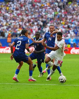 Jude Bellingham of England takes the ball past Malo Gusto of France whilst under pressure from Dayot Upamecano of France and Adrien Rabiot of France France v England, 2026 FIFA World Cup, WM, Weltmeisterschaft, Fussball 3rd Place Final, Football, Miami Stadium, Miami, Florida, USA - 18 Jul 2026Miami Miami Stadium Florida (FL) United States of America  Copyright: xJavierxGarcia Shutterstockx 16995468ch