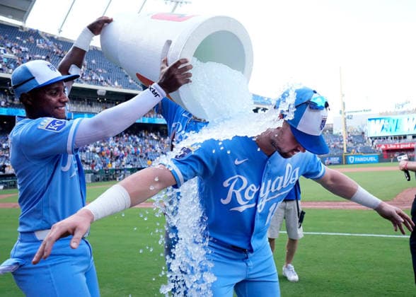 July 18, 2026: Kansas City Royals second baseman Tyler Tolbert (2) and Kansas City Royals catcher Carter Jensen (22) apply the Gatorade bath to the game MVP Kansas City Royals center fielder Lane Thomas (15) after the win against the Padres at Kauffman Stadium Kansas City, Missouri. CSM. Kansas City United States - ZUMAc04_ 20260718_zma_c04_058 Copyright: xJonxRobichaudx
