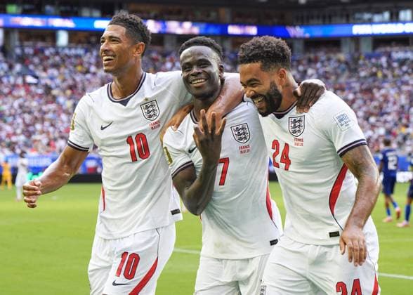 Football: 2026 World Cup England s Bukayo Saka (C) celebrates with Jude Bellingham (L) and Reece James after scoring a hat-trick in the second half of the World Cup third-place football match against France at Miami Stadium in Miami Gardens, Florida, on July 18, 2026.  A14AA0005623566P