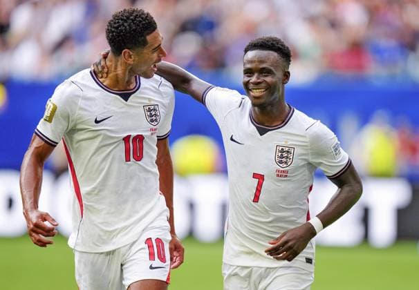 Football: 2026 World Cup England s Bukayo Saka (R) celebrates with Jude Bellingham after scoring a hat-trick from the penalty spot in the second half of the World Cup third-place football match against France at Miami Stadium in Miami Gardens, Florida, on July 18, 2026.  A14AA0005623569P