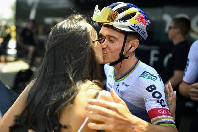 Belgian Remco Evenepoel and his wife Oumaima Oumi Rayane pictured at the start of stage 15 of the 2026 Tour de France cycling race, a stage of 184km from Champagnole to Plateau de Solaison, on Sunday 19 July 2026. The 113th edition of the Tour de France starts on Saturday 4 July in Barcelona, Spain, and will finish in Paris, France on the 26th of July. JASPERxJACOBS  x181467355x