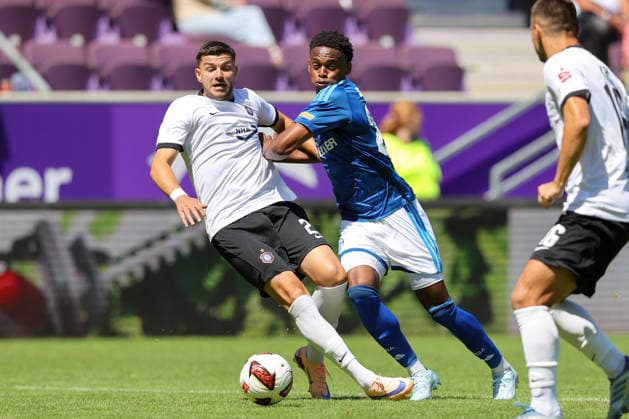 19.07.2026, xtgx, Fussball - Testspiel Erzgebirge Aue - FC Schalke 04 v.l. Stylianos Kokovas (Aue, 29), Junior Adamu (Schalke, 20) Zweikampf, Duell, Kampf, tackle (DFL DFB REGULATIONS PROHIBIT ANY USE OF PHOTOGRAPHS as IMAGE SEQUENCES and or QUASI-VIDEO) Aue *** July 19, 2026, xtgx, Soccer Friendly Match: Erzgebirge Aue vs. FC Schalke 04, by Stylianos Kokovas, Aue, 29, Junior Adamu (Schalke), 20, tackle, duel, battle, DFL and DFB regulations prohibit any use of photographs as image sequences and or quasi-video, Aue