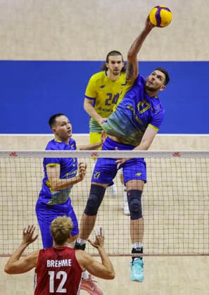 WomenÕs Volleyball Nations League - Belgrade 2026 Ukraine s Vladyslav Shchurov spikes the ball against Germany s Anton Brehme during the MenÕs Volleyball Nations League Pool 7 match between Germany and Ukraine at Belgrade Arena on July 19, 2026 in Belgrade, Serbia. Belgrade Serbia Copyright: xSrdjanxStevanovicx x