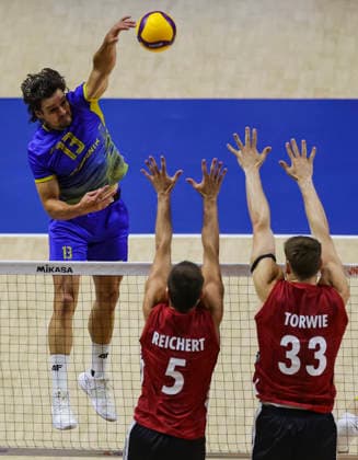 WomenÕs Volleyball Nations League - Belgrade 2026 Ukraine s Vasyl Tupchii spikes the ball against Germany s Moritz Reichert and Germany s Simon Valentin Torwie during the MenÕs Volleyball Nations League Pool 7 match between Germany and Ukraine at Belgrade Arena on July 19, 2026 in Belgrade, Serbia. Belgrade Serbia Copyright: xSrdjanxStevanovicx x