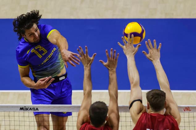 WomenÕs Volleyball Nations League - Belgrade 2026 Ukraine s Vasyl Tupchii spikes the ball against Germany s Moritz Reichert and Germany s Simon Valentin Torwie during the MenÕs Volleyball Nations League Pool 7 match between Germany and Ukraine at Belgrade Arena on July 19, 2026 in Belgrade, Serbia. Belgrade Serbia Copyright: xSrdjanxStevanovicx x