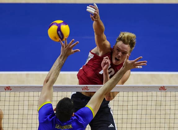 Women™s Volleyball Nations League - Belgrade 2026 Germany s Anton Brehme spikes the ball against Ukraine s Yurii Semeniuk during the Men™s Volleyball Nations League Pool 7 match between Germany and Ukraine at Belgrade Arena on July 19, 2026 in Belgrade, Serbia. Belgrade Serbia Copyright: xSrdjanxStevanovicx x