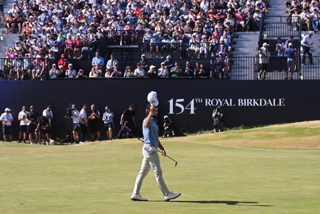Cameron Young (USA) splashes out of a bunker on the 18th Green, almost holes it but drops a shot to -9 but is the clubhouse leader. As he leaves the green and salutes the crowd. 154th Open Golf Championships, Royal Birkdale, Southport, UK - 19 Jul 2026Southport Royal Birkdale United Kingdom  Copyright: xGreigxCowie Shutterstockx 16988299s