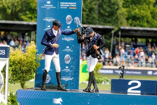 RIESENBECK - Longines Global Champions Tour of Riesenbeck 2026, RIESENBECK - Longines Global Champions Tour of Riesenbeck 2026 BETTENDORF Victor (LUX), DEUSSER Daniel (GER), KUKUK Christian (GER) Sektdusche Podest Siegerehrung Prize giving ceremony Longines GCT Grand Prix of Riesenbeck CSI5* - Int. jumping competition against the clock with jump-off (1.60 m) Riesenbeck, Riesenbeck International 19. July 2026 - *** RIESENBECK Longines Global Champions Tour of Riesenbeck 2026, RIESENBECK Longines Global Champions Tour of Riesenbeck 2026 BETTENDORF Victor LUX, DEUSSER Daniel GER, KUKUK Christian GER Sparkling wine shower Podium Prize-giving ceremony Longines GCT Grand Prix of Riesenbeck CSI5* International jumping competition against the clock with a jump-off 1 60 m Riesenbeck, Riesenbeck International July 19, 2026