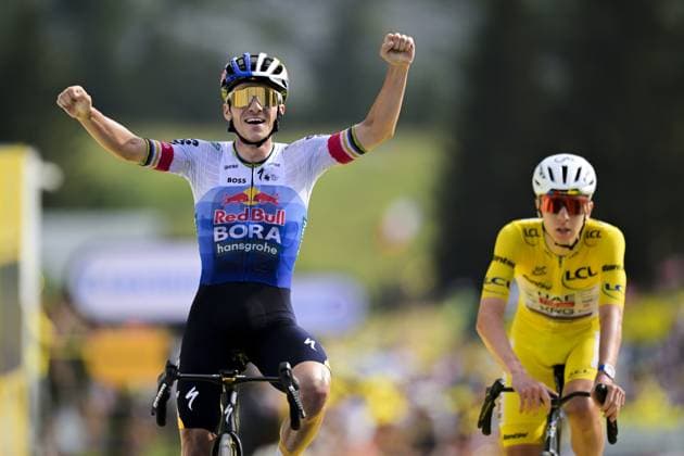 Belgian Remco Evenepoel of Red Bull-BORA-hansgrohe celebrates as he wins ahead of Slovenian Tadej Pogacar of UAE Team Emirates XRG stage 15 of the 2026 Tour de France cycling race, a stage of 184km from Champagnole to Plateau de Solaison, on Sunday 19 July 2026. The 113th edition of the Tour de France starts on Saturday 4 July in Barcelona, Spain, and will finish in Paris, France on the 26th of July. DAVIDxPINTENS  x181484458x