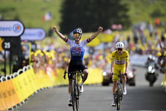 Belgian Remco Evenepoel of Red Bull-BORA-hansgrohe celebrates as he wins ahead of Slovenian Tadej Pogacar of UAE Team Emirates XRG stage 15 of the 2026 Tour de France cycling race, a stage of 184km from Champagnole to Plateau de Solaison, on Sunday 19 July 2026. The 113th edition of the Tour de France starts on Saturday 4 July in Barcelona, Spain, and will finish in Paris, France on the 26th of July. DAVIDxPINTENS  x181484474x
