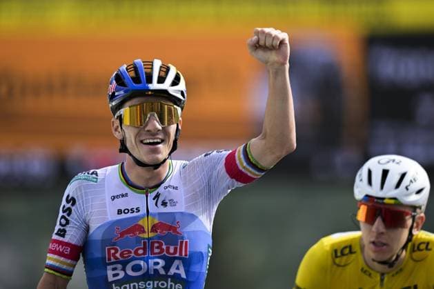 Belgian Remco Evenepoel of Red Bull-BORA-hansgrohe celebrates as he wins ahead of Slovenian Tadej Pogacar of UAE Team Emirates XRG stage 15 of the 2026 Tour de France cycling race, a stage of 184km from Champagnole to Plateau de Solaison, on Sunday 19 July 2026. The 113th edition of the Tour de France starts on Saturday 4 July in Barcelona, Spain, and will finish in Paris, France on the 26th of July. DAVIDxPINTENS  x181485011x