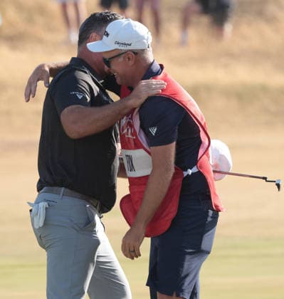 New Zealand s Ryan Fox embraces his caddy after his victory at the 154th Open Championship at Royal Birkdale in Southport, on Sunday, July 19, 2026. Cox won the tournament with a score of ten under par.  LON2026071912 HUGOxPHILPOTT
