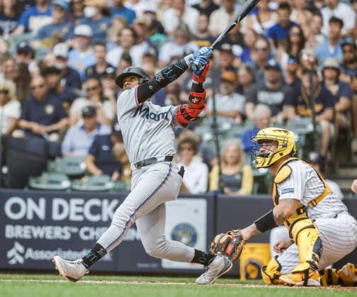 Miami Marlins right fielder Esteury Ruiz hits a home run in front of Milwaukee Brewers catcher Gary Sanchez in the third inning of the MLB, Baseball Herren, USA game between the Miami Marlins and the Milwaukee Brewers at American Family Field in Milwaukee, Wisconsin on Sunday July 19, 2026.  MIL20260719807 TANNENxMAURY